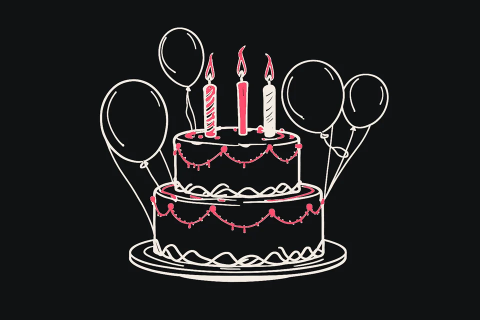 A birthday cake with candles shaped like the number 18, balloons and a sparkler