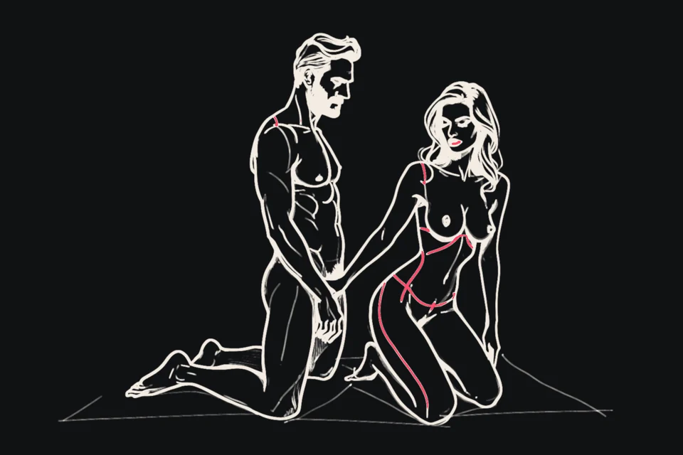 A kneeling woman close to a standing man