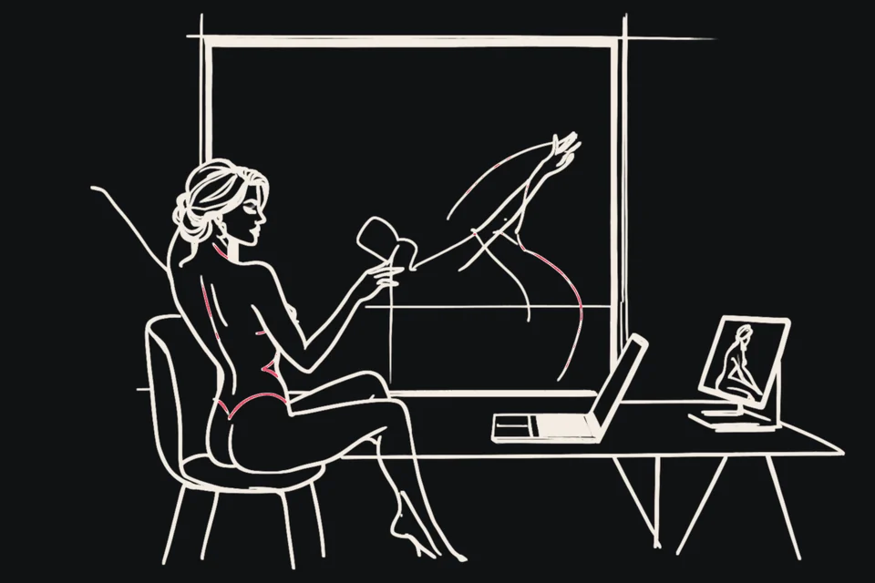 A woman waves at a video call on her laptop