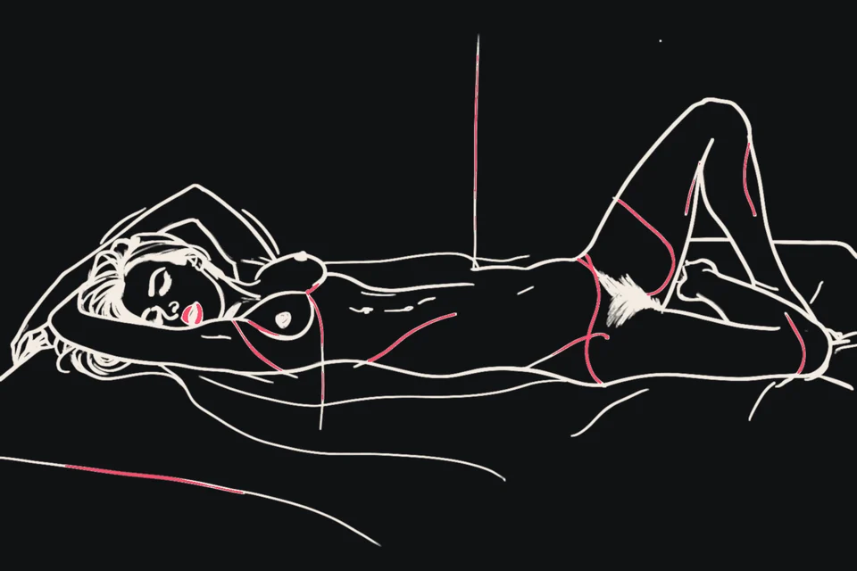 A woman arches her back on a bed