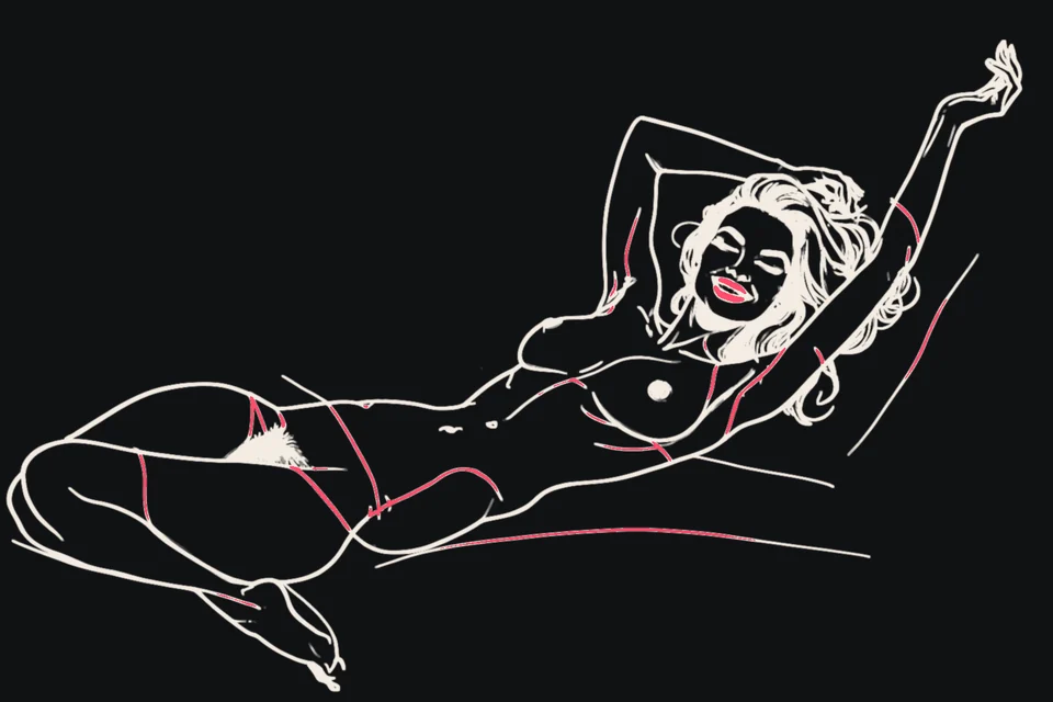 A woman lies back with her arms raised, relaxed