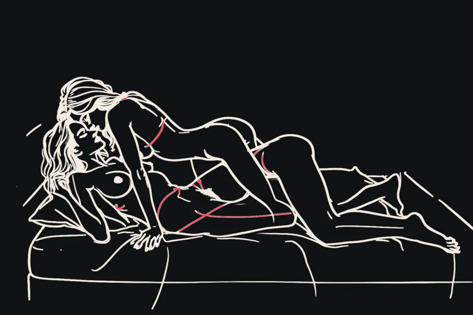 A couple together on a bed